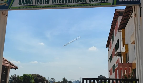 A clear daytime view of the entrance arch at Gnana Jyothi International School highlighting the nearby educational options for Sobha World City residents