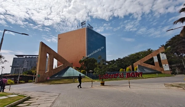 Wide view of the Bearys Global Research Triangle entrance against a blue sky, demonstrating seamless connectivity for Sobha World City residents