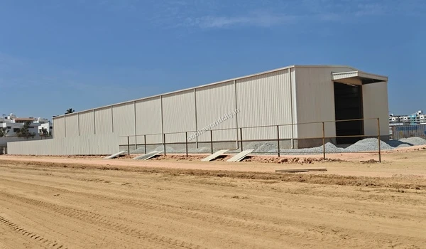 Temporary white metal boundary barricading installed to secure the perimeter of Sobha World City