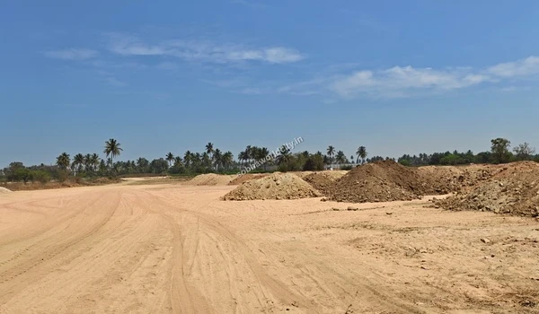 Temporary construction depot and material shed set up on the leveled ground of the Sobha World City property