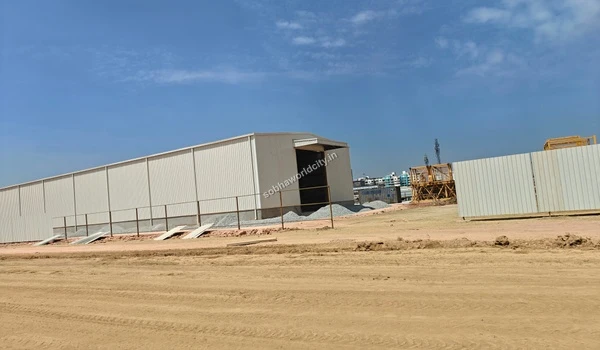 Large temporary white metal construction warehouse and storage facility built at Sobha World City