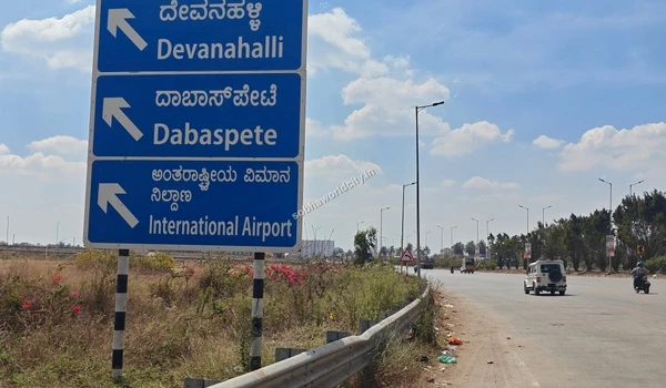 Clear highway signage indicating the route towards Dabaspete and the International Airport, highlighting the excellent connectivity from Sobha World City