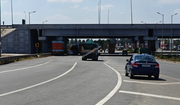 Everyday local traffic including passenger cars efficiently navigating the main underpass crossing right by Sobha World City.