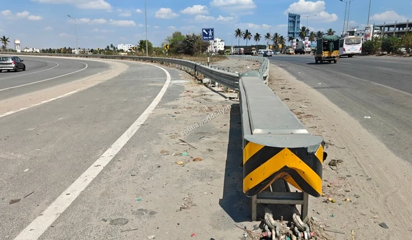 Perspective of the descending ramp destined for Hosur Road, separating from the primary Kolar highway path, a key feature of Sobha World City's locale.