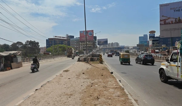 The impressive grand entrance road of Sobha World City designed for elite connectivity with KR Puram