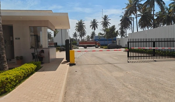 Security personnel stationed at the entrance checkpoint of the Sobha Stonecraft granite processing plant for Sobha World City