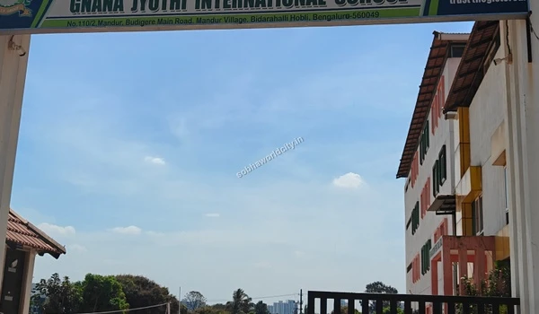 View of the Gnana Jyothi International School entrance arch showcasing educational infrastructure near Sobha World City