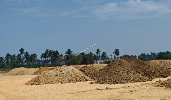 Close up view of various groundwork soil heaps and raw materials prepared for land leveling at the Sobha World City site