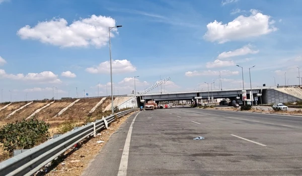 Driving through the Hoskote road connecting to the Kolar underpass, showcasing excellent infrastructure near Sobha World City