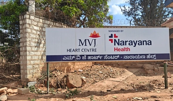 Close up shot of the upper section of the MVJ Medical College and Research Hospital entrance gate in the Sobha World City neighborhood