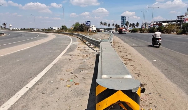 The clearly marked diversion ramp heading towards Hosur Road, adjacent to the main highway to Kolar from Sobha World City.