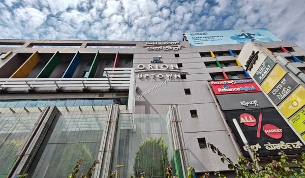 Ground-level view of the dedicated pedestrian entrance and vehicle drop-off area for the hotel and commercial plaza easily accessible from Sobha World City