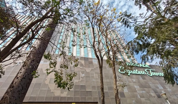 Street view of the bustling IT park entrance near Brigade Signature Towers, offering seamless connectivity for Sobha World City residents