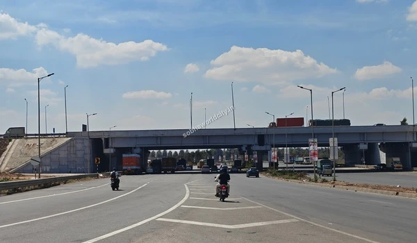 A view of the major road junction with an underpass, facilitating travel to Sobha World City.
