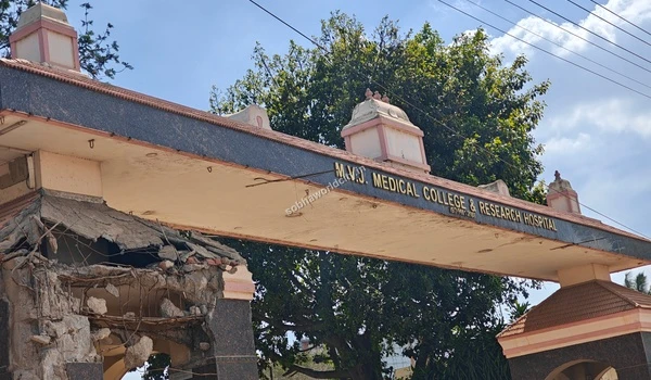 Detailed view of the damaged pillar at the main archway entrance of MVJ Medical College and Research Hospital near Sobha World City