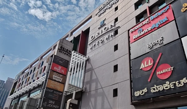 Large retail signage highlighting PVR cinemas and anchor department stores like Max and Pantaloons providing entertainment for Sobha World City residents
