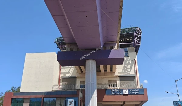 Sunlit view of the Namma Metro infrastructure at Whitefield showcasing the robust and efficient transport network surrounding Sobha World City