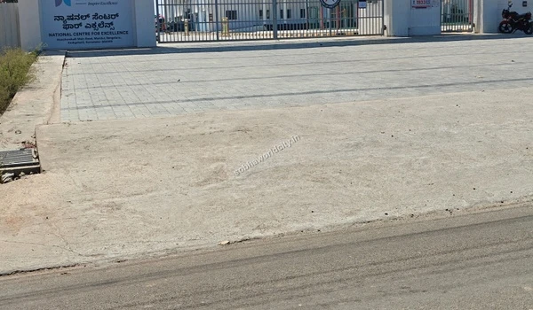 The fenced and secure perimeter of the National Centre for Excellence prioritizing student safety near Sobha World City