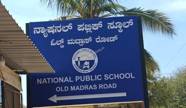 National Public School Old Madras Road signage, showcasing the proximity of renowned schools to the Sobha World City residential project.