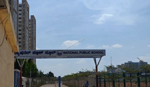 Wide view of the National Public School main gate on Old Madras Road, a premier school option situated close to Sobha World City.