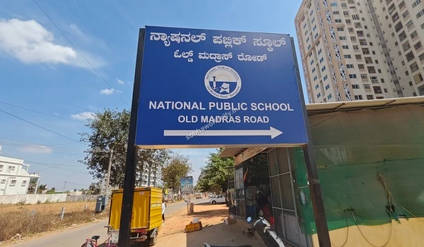 Navigation sign for National Public School located along the OMR corridor, extremely accessible from the Sobha World City project.