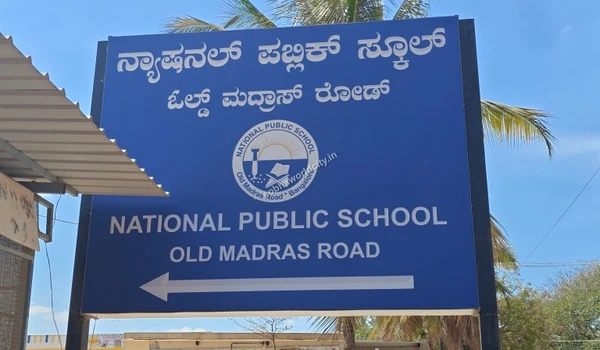 View of the National Public School board on Old Madras Road, showcasing the excellent social infrastructure right outside Sobha World City.