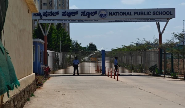 Security guards stationed at the National Public School main gate, providing a safe and secure learning environment near Sobha World City.