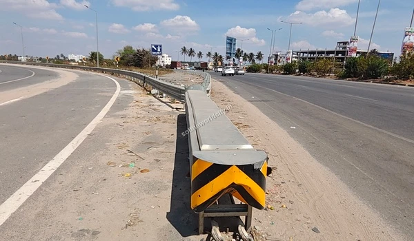 The well-planned highway intersection showcasing the continuous straight route to Kolar and the essential Hosur Road branch near Sobha World City.