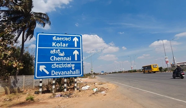 The wide, well-maintained primary access road leading directly to the luxurious entrance of Sobha World City.