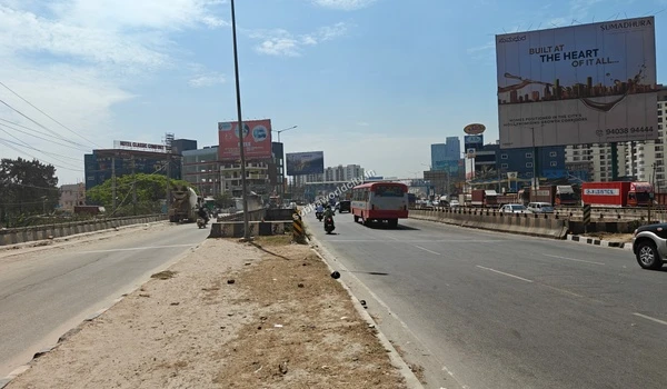 Perspective view from the project site entrance showcasing the prime connectivity route to KR Puram