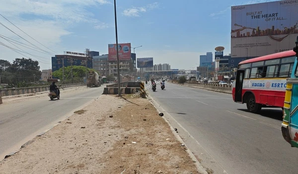 A state transport KSRTC bus passing by the main road towards Hoskote, highlighting the excellent public transport access from Sobha World City.