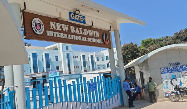 The multi-story school building facade of New Baldwin International School accessible from Sobha World City