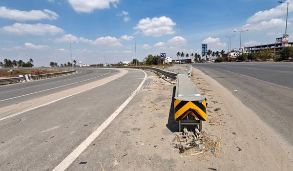 Smooth traffic flow on the highway ramp leading to Hosur Road, highlighting the prime location of Sobha World City.
