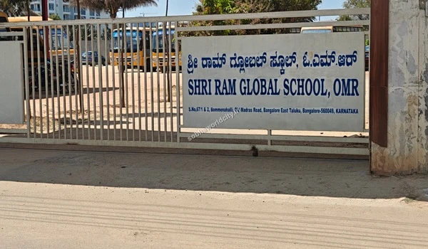 A bright street level view of the Shri Ram Global entry demonstrating excellent infrastructure surrounding Sobha World City