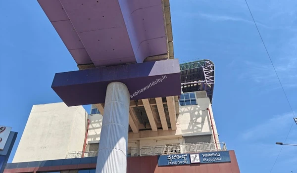 Architectural view of the modern Whitefield metro station building and overpass supporting seamless daily commutes to Sobha World City