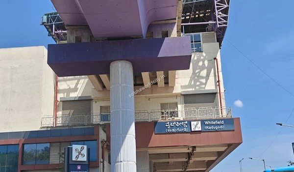 Street level view capturing the Whitefield metro station entrance and nearby road transport options connecting seamlessly to Sobha World City