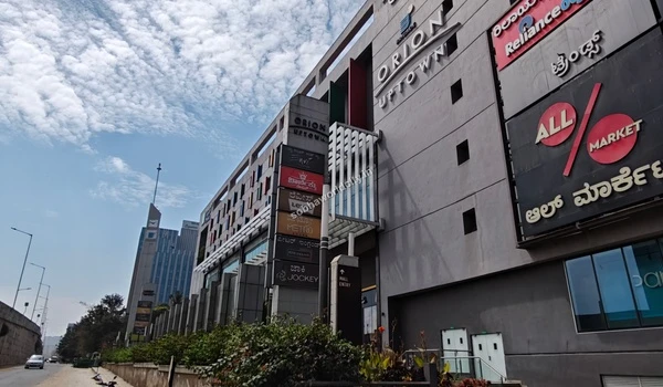 Close up of the shopping mall signage displaying top brand outlets like Levis and Metro near Sobha World City